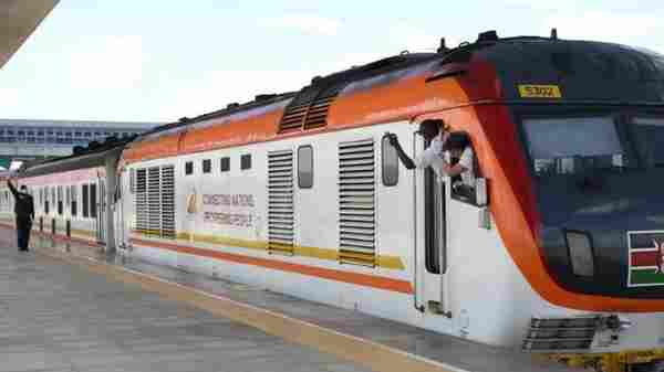 Standard Gauge Railway train transporting cargo across Kenya landscape