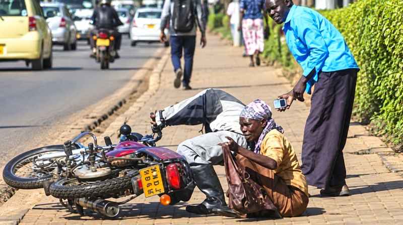 What to Do If a Boda Boda Knocks You Down on a Pavement in Kenya Boda boda riding near pedestrians on a pavement in Kenya
